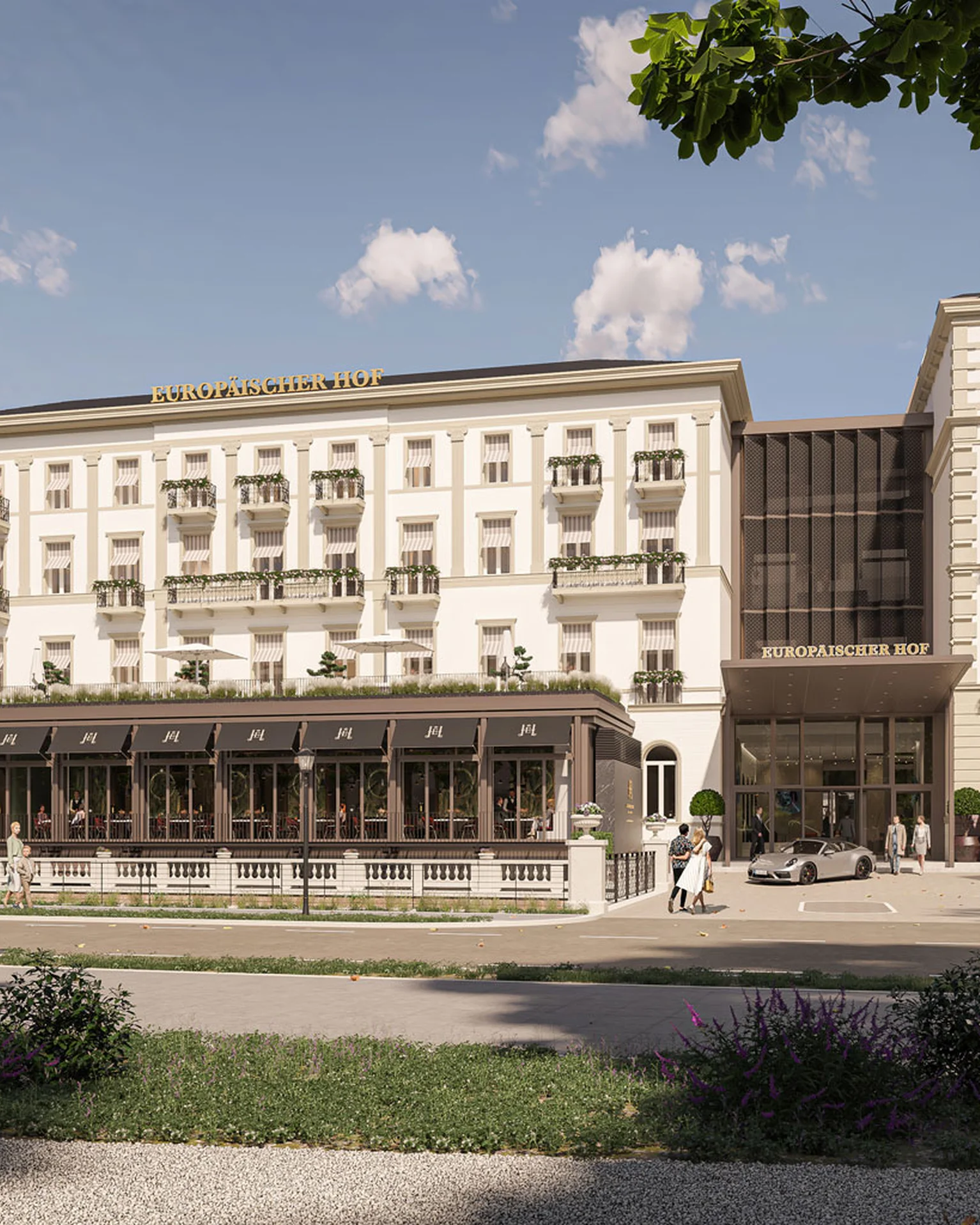 Ein großes historisches Hotel mit klassischer Architektur, umgeben von Bäumen und einem Spazierweg im Vordergrund an einem sonnigen Tag.